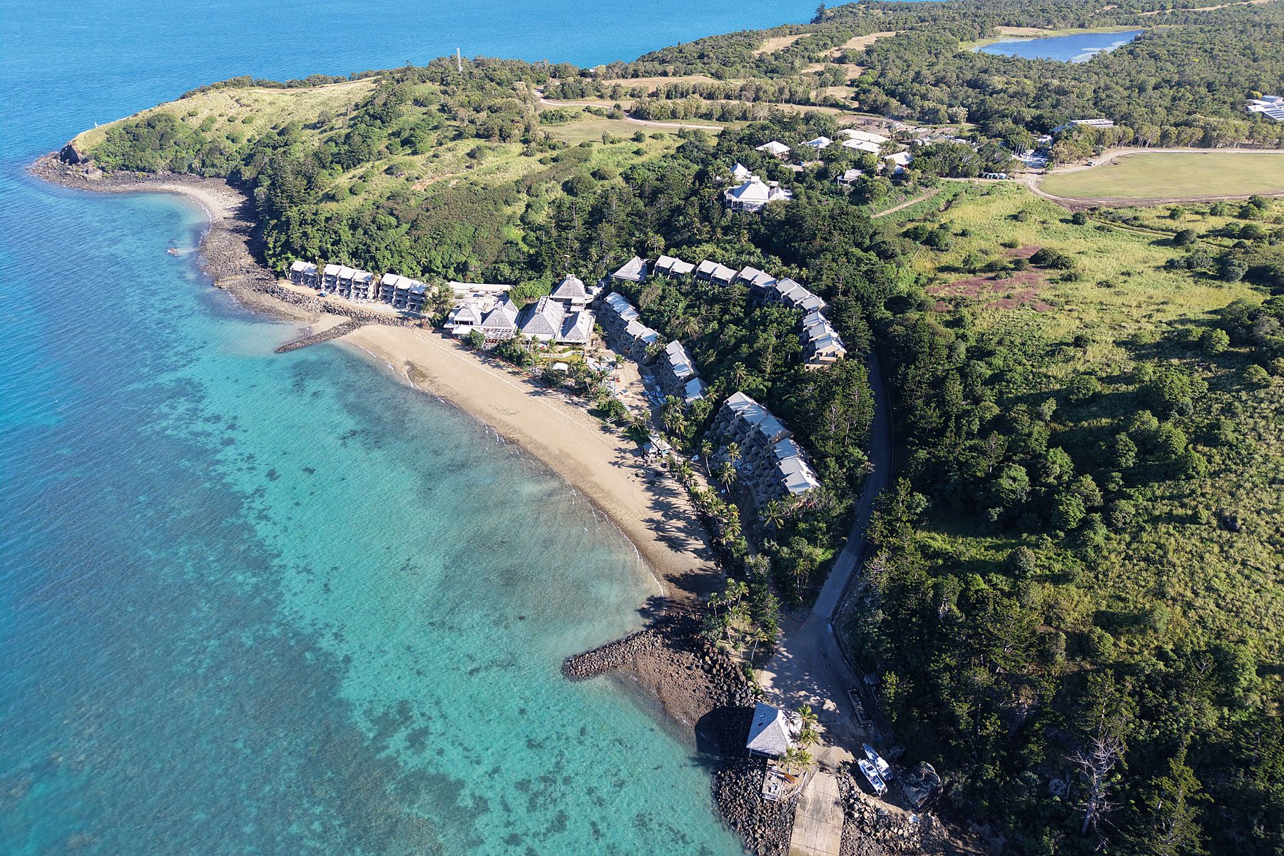 A bay on Lindeman Island with a headland beyond